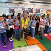 "Grit Leads to Greatness" book reading by a builder to kids in the classroom