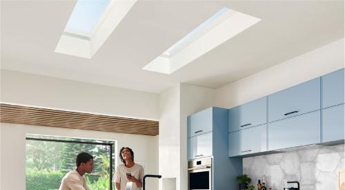 Couple sitting under a skylight in the kitchen