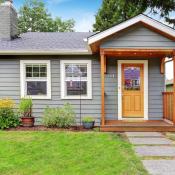 Small blue house with wooden front porch