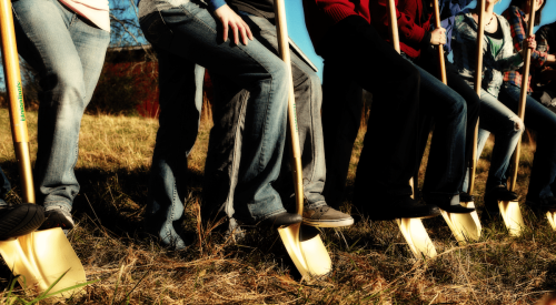 Women volunteers at groundbreaking for new home build