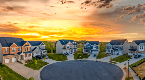 Sun rises over community of single-family homes