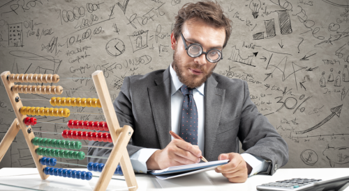 Man calculating off-site building costs 